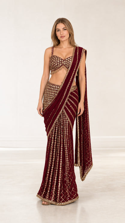 Wine red pre-draped festive saree set with intricate metallic embroidery