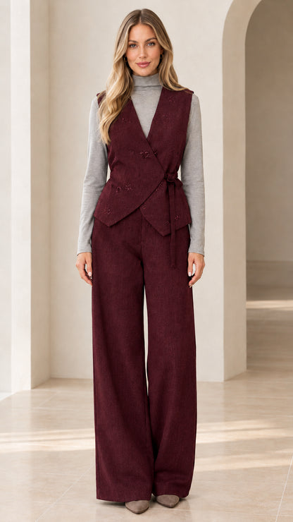 Woman wearing burgundy wine red wrap tie vest and matching wide-leg trousers