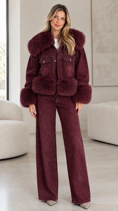 Model wearing burgundy wine denim jacket with matching burgundy faux fur trim and wide-leg jeans