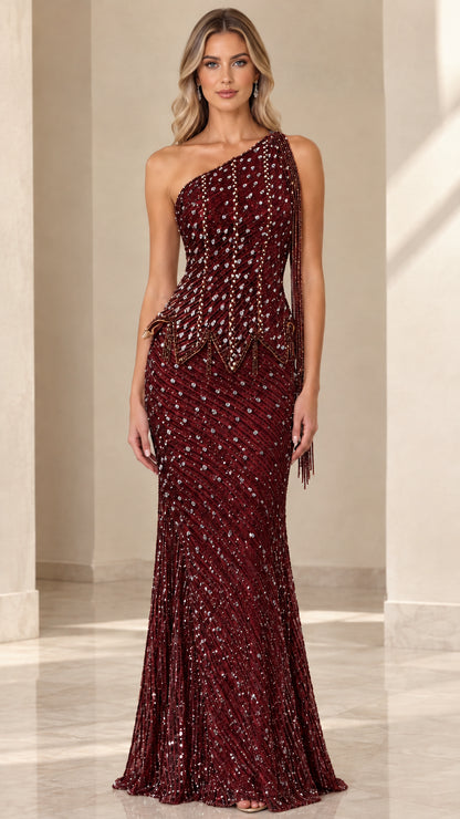 Model wearing Burgundy one-shoulder beaded trumpet evening gown
