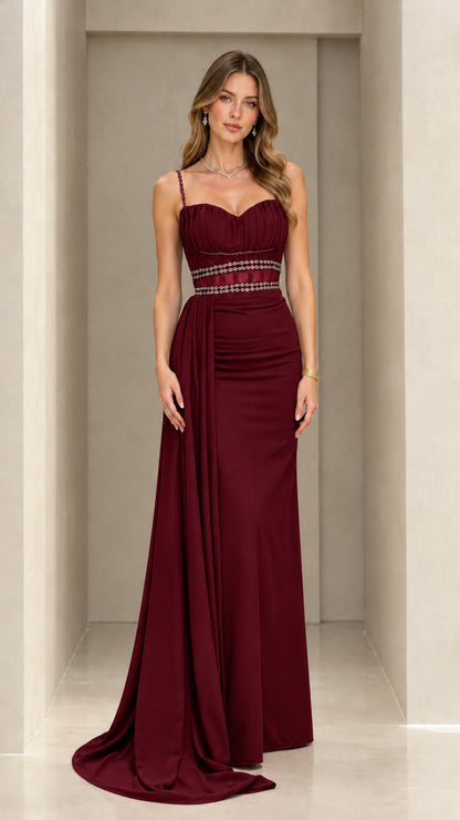 Front view of burgundy formal maxi evening gown with embellished waist