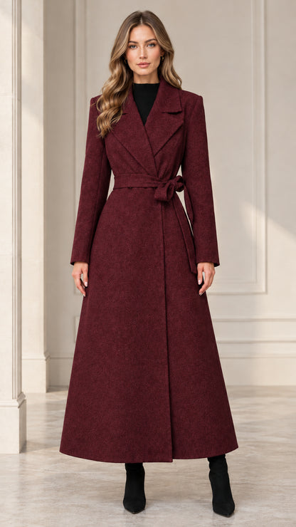 Front view of woman wearing the deep burgundy belted maxi wrap coat
