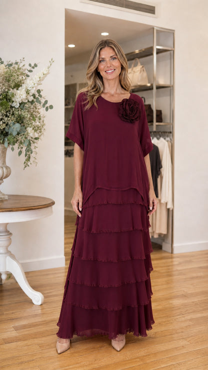 Model wearing burgundy tiered ruffle maxi dress