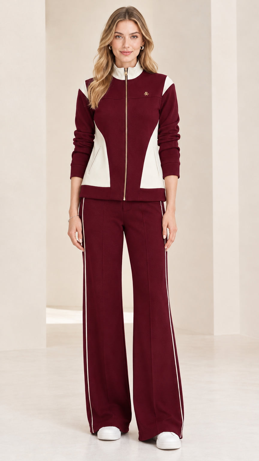 Front view of woman wearing burgundy wine and white colorblock tracksuit set