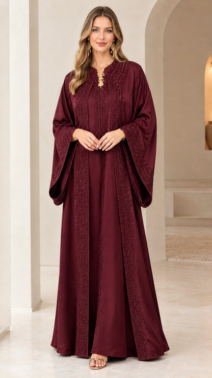 Front view of woman wearing burgundy wine red embroidered caftan maxi dress