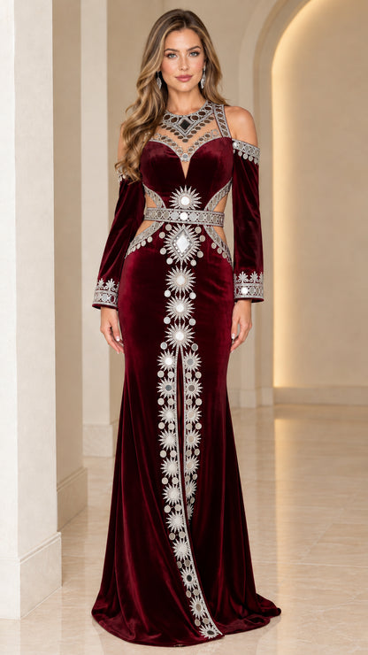 Model wearing Burgundy red embellished velvet cold-shoulder evening gown with waist cutouts