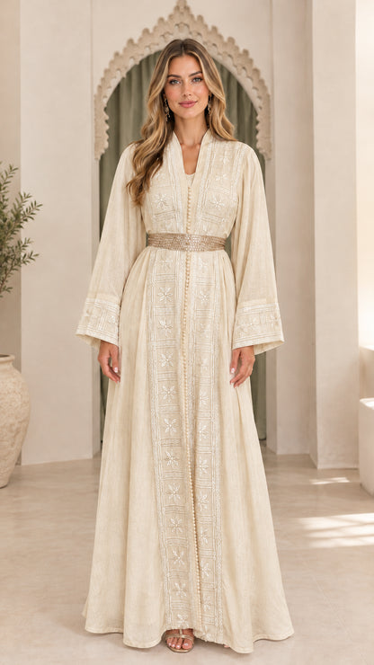 Model wearing champagne beige embroidered long sleeve abaya gown