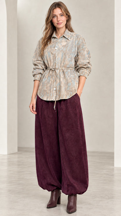 Model wearing Beige Sand abstract print belted button-down shirt jacket