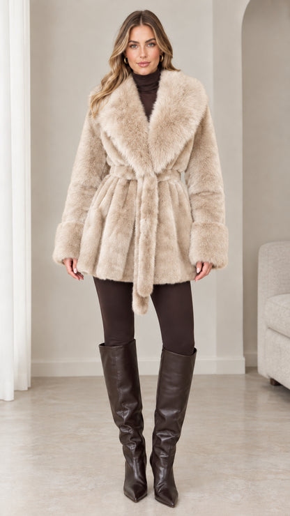Front view of model wearing cream beige plush faux fur belted wrap coat