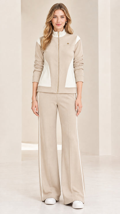 Front view of woman wearing beige oatmeal and white colorblock tracksuit set
