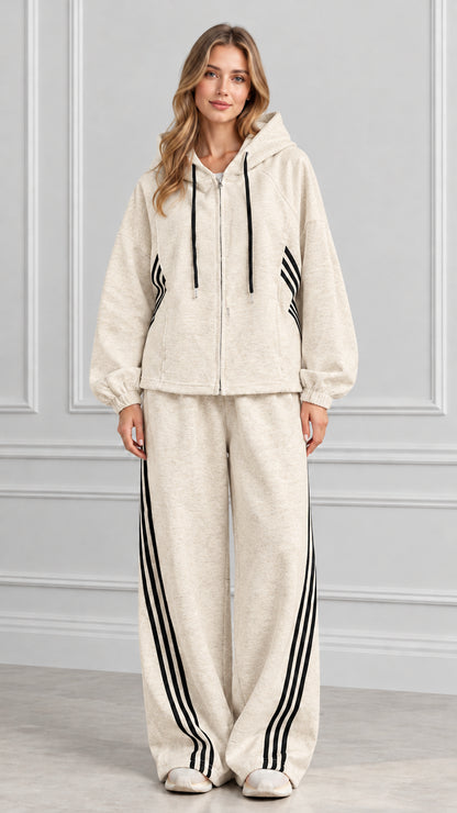 Front view of woman wearing Oatmeal beige zip-up hoodie and wide-leg striped pants set