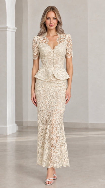 Front view of woman wearing champagne floral lace peplum maxi two-piece set